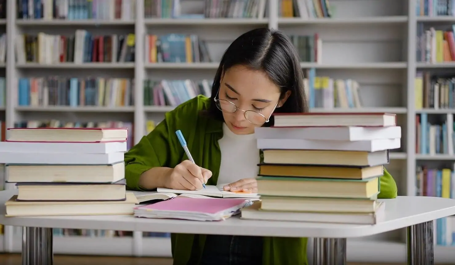 Student taking notes while learning